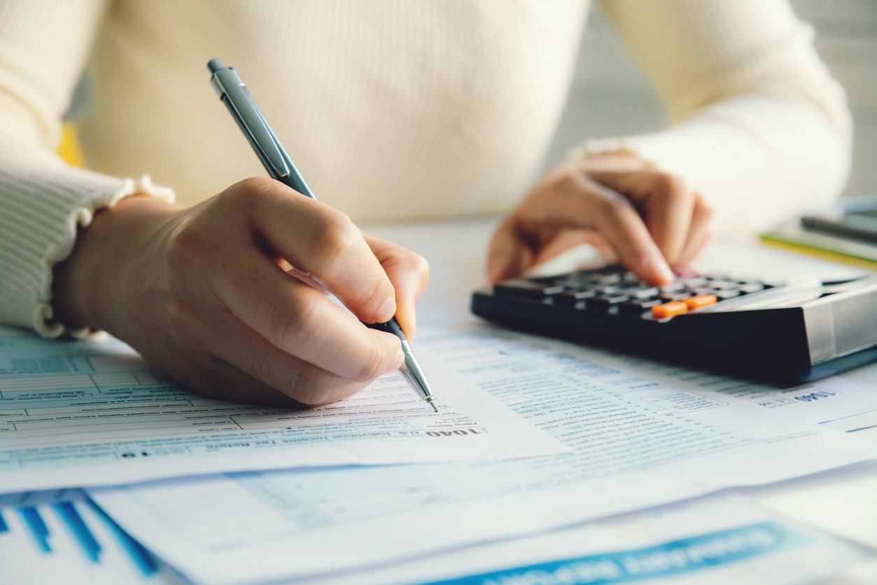 Woman using calculator