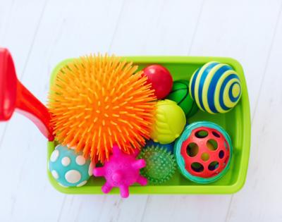 sensory bin with colorful toys
