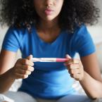 Teenager holding pregnancy test