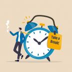 Illustration of worker taking a break next to large alarm clock
