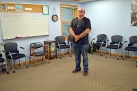 Joshua Grondahl standing in a group therapy group room