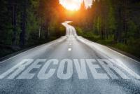 Road with the word recovery across it