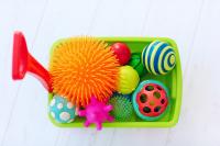 sensory bin with colorful toys